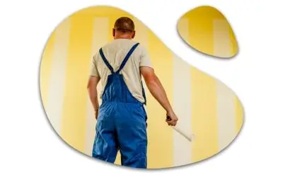 Painter looking at the wall in Dubai